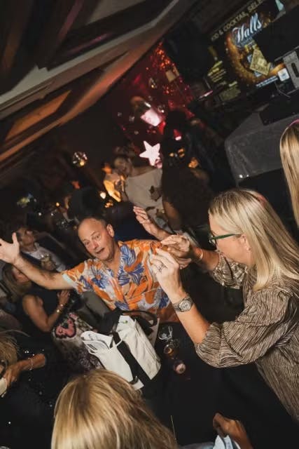 a group of people standing in front of a crowd