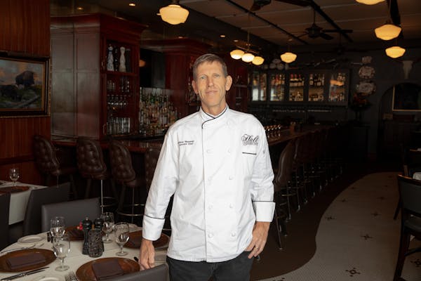 a man standing in front of a table