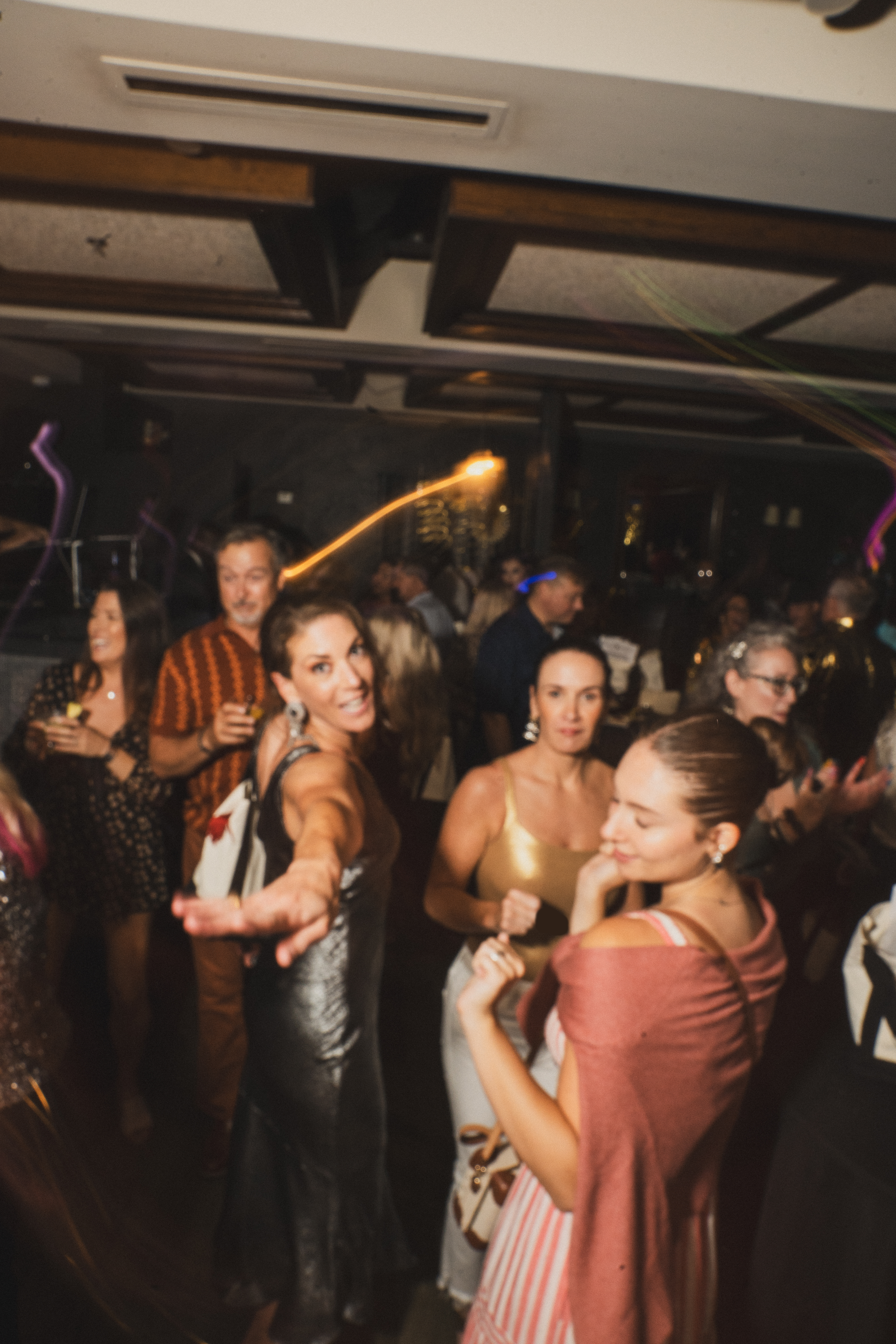 a group of people standing in front of a crowd