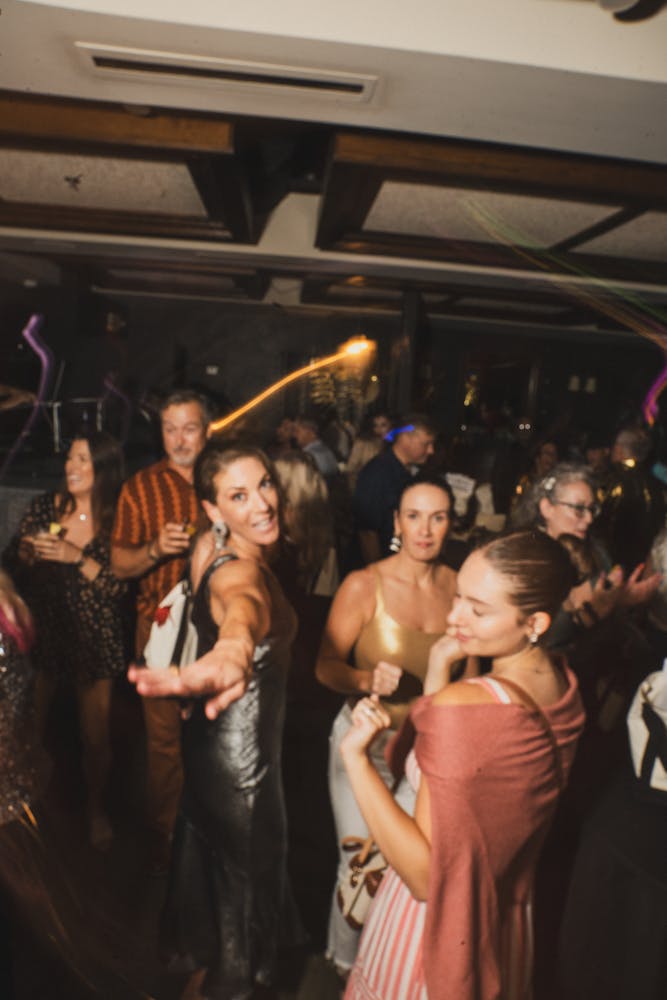 a group of people standing in front of a crowd