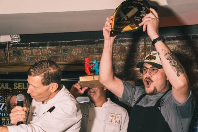 a man holding a wine glass