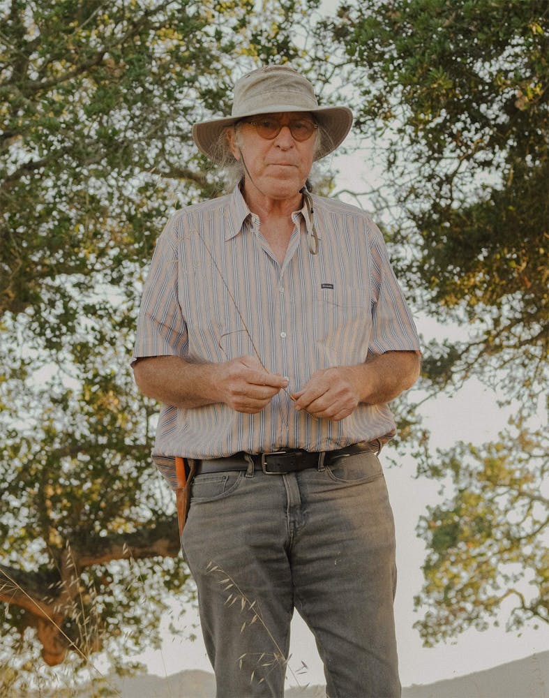 Randall Grahm standing next to a tree