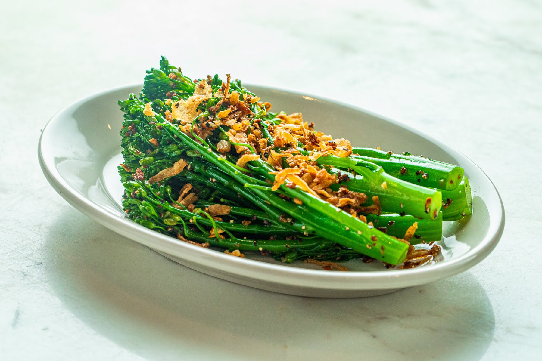 a bowl of food with broccoli