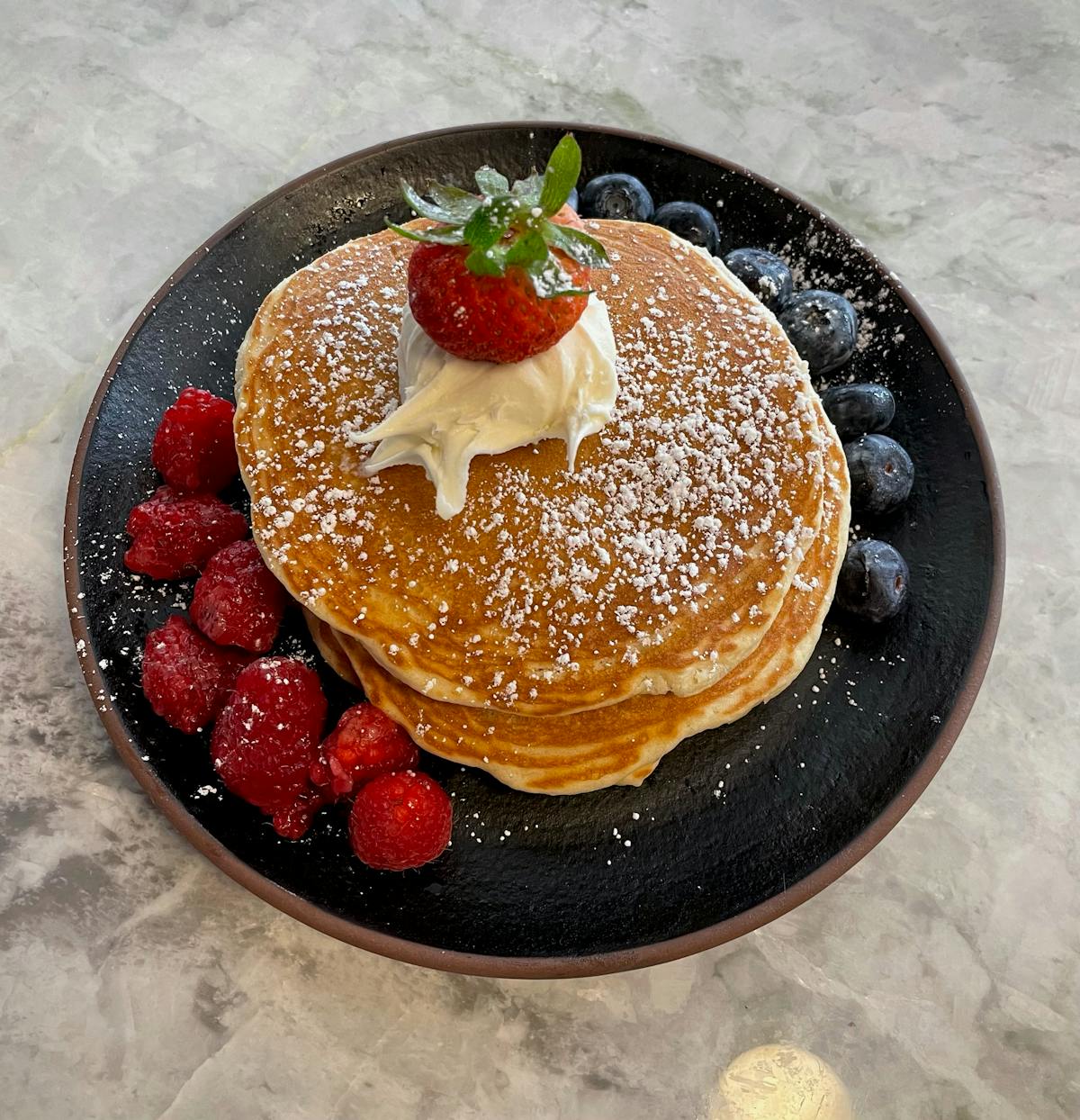a bowl of fruit on a plate