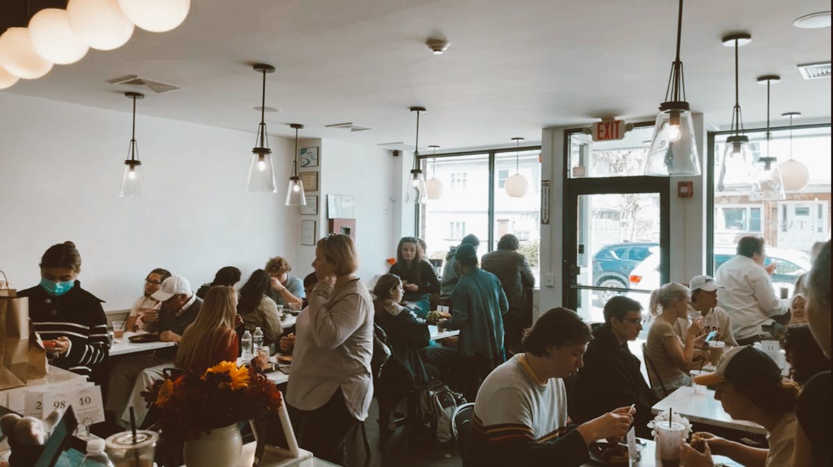 a group of people sitting at a table with wine glasses