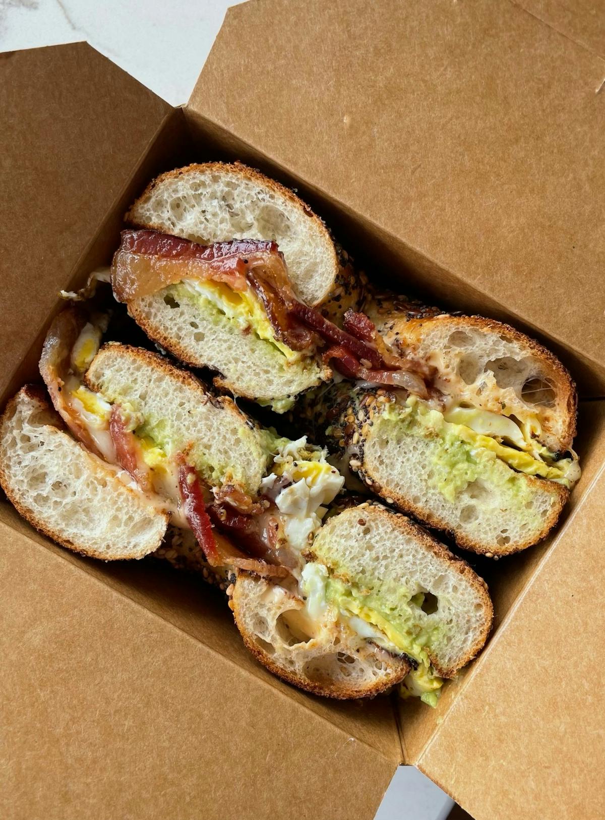 a sandwich sitting on top of a wooden table