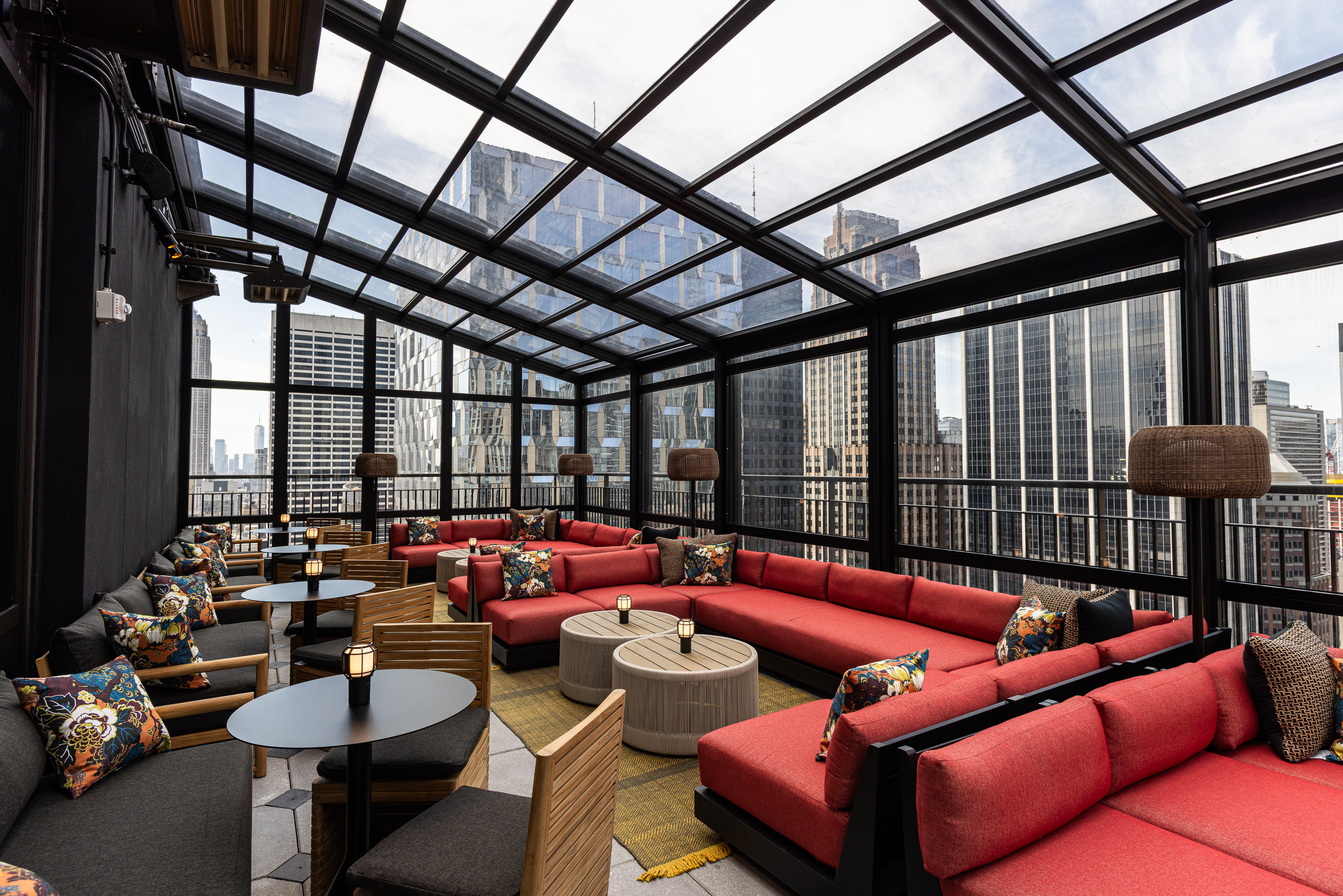 a room with a glass roof and a large window