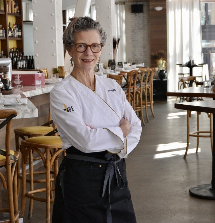 a person sitting at a table in a restaurant