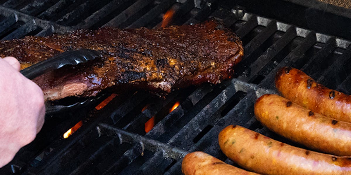 a hot dog on a grill