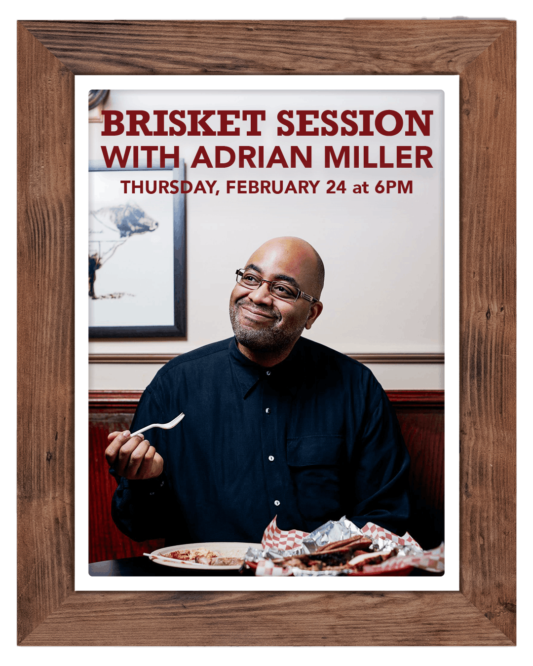 Adrian Miller holding a book