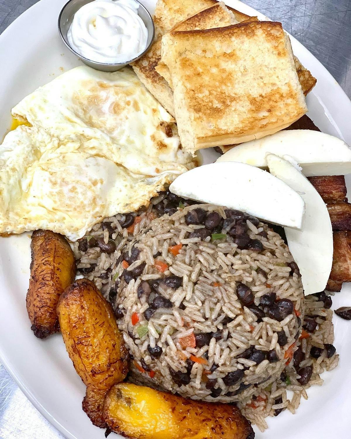 a plate of food with a slice of bread