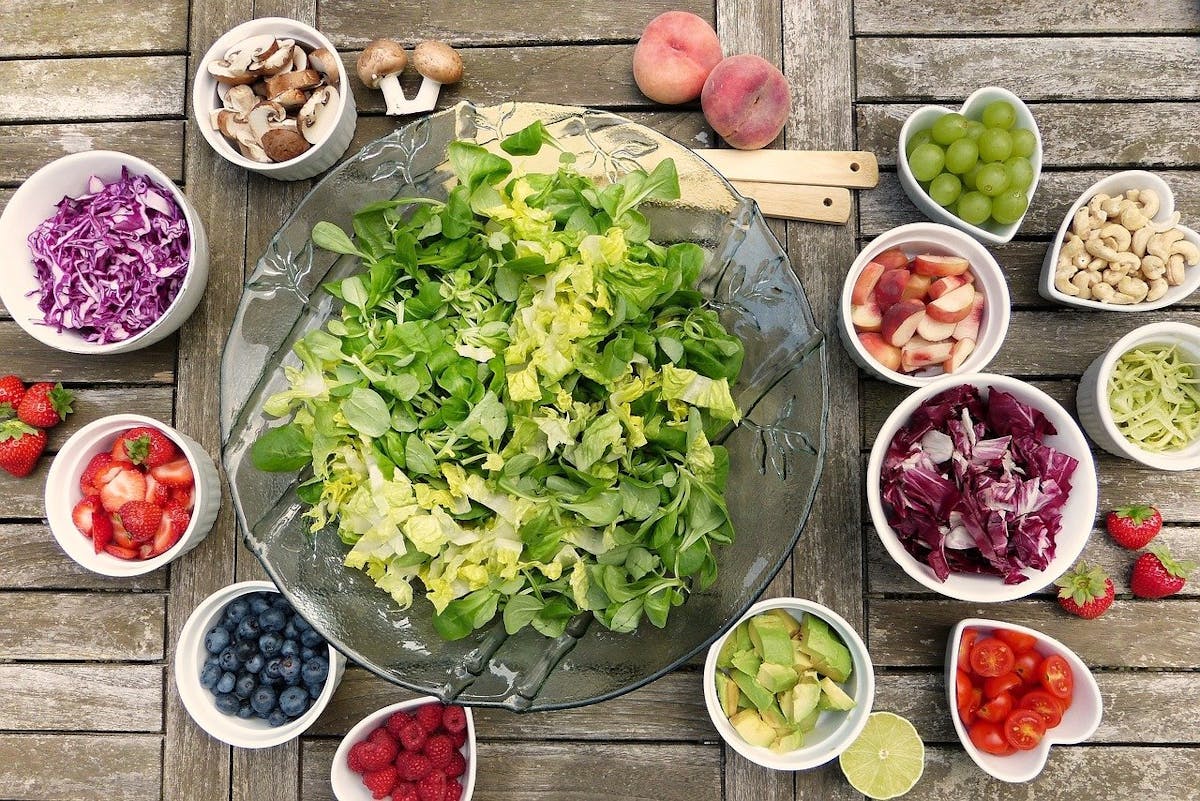 a bunch of different types of food on a table