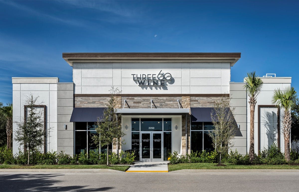 a small clock tower in front of a house