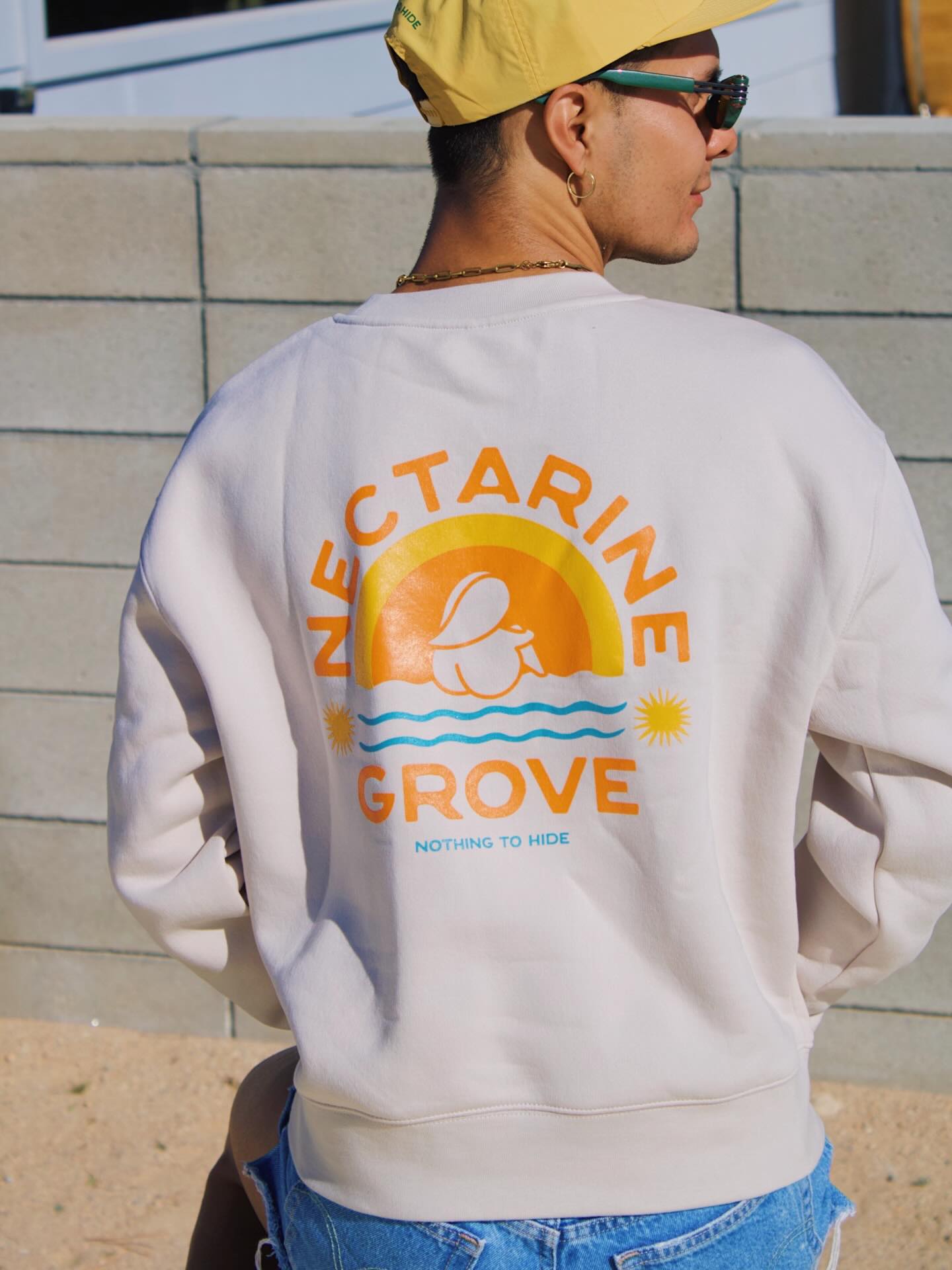a man wearing a white sweatshirt
