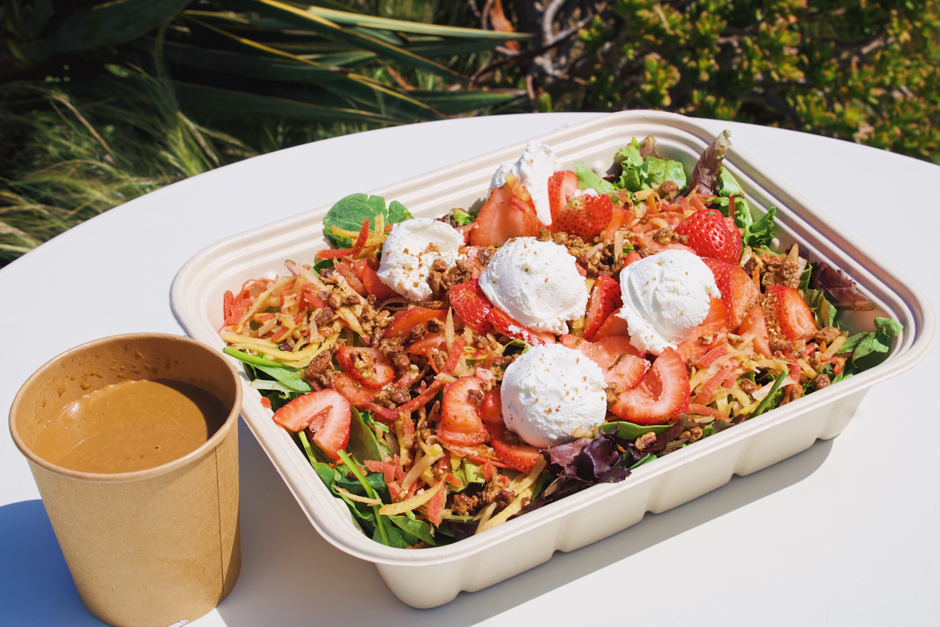 a tray of salad on a table