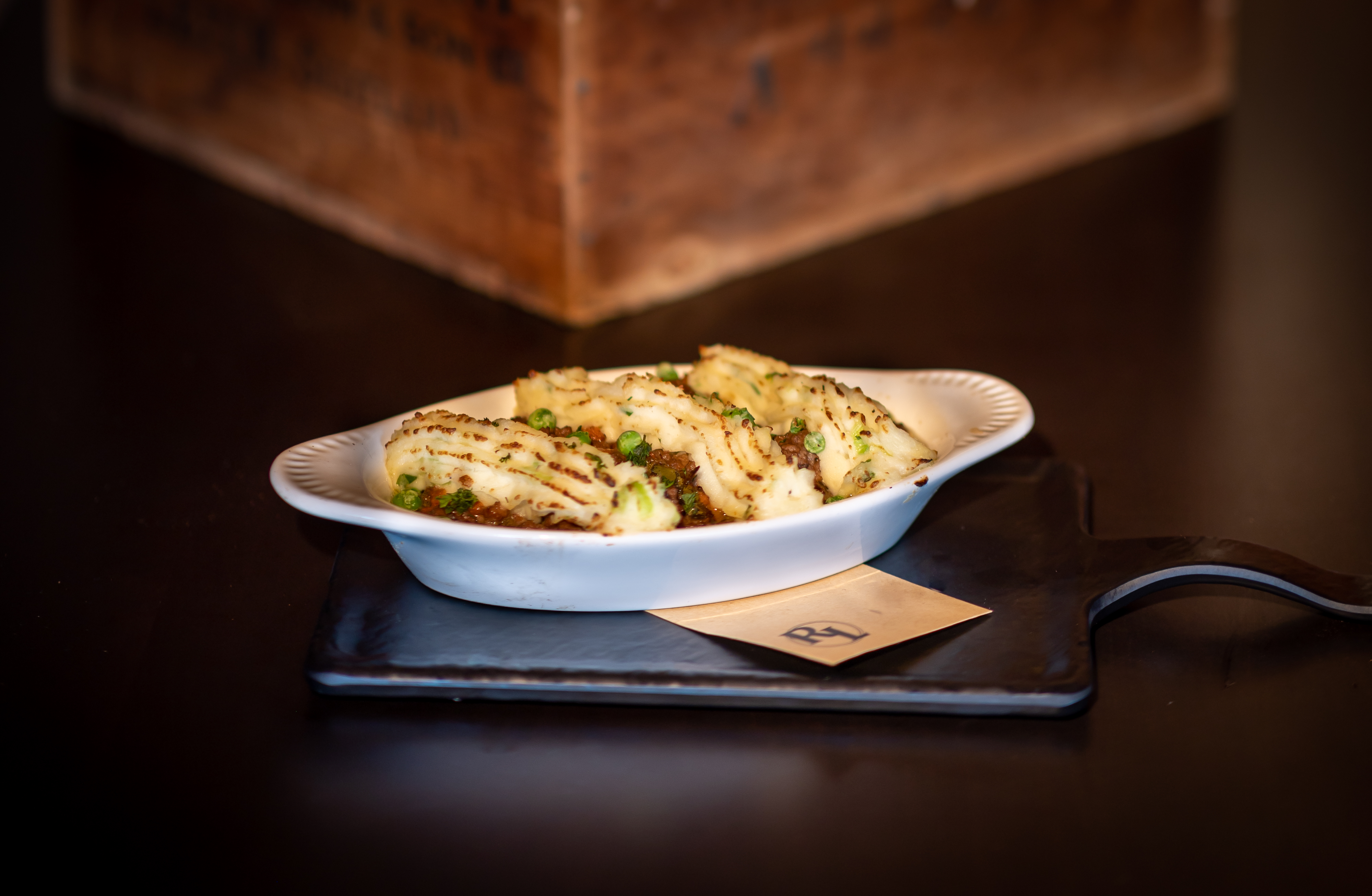 a bowl of food sitting on a table