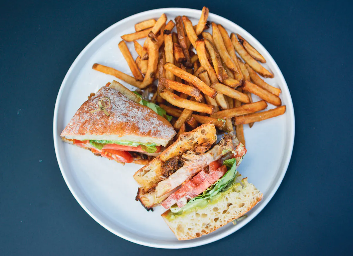 a sandwich and fries on a plate