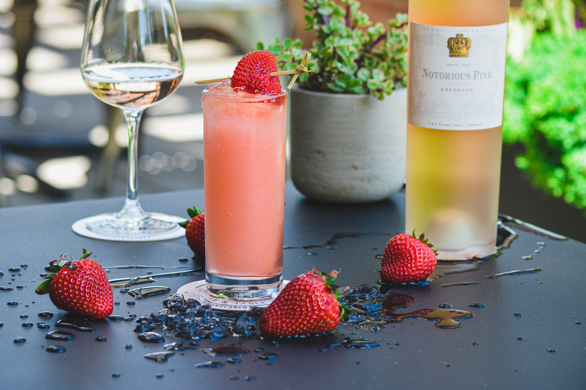 a plate of food and a glass of wine