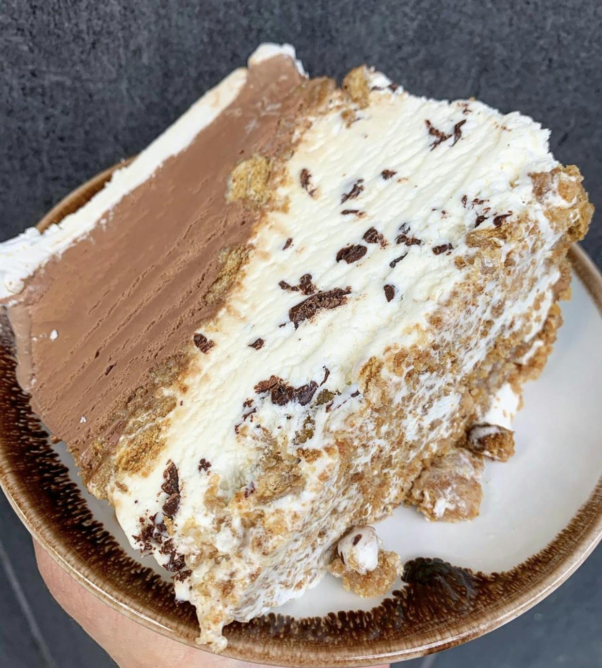 a piece of cake and ice cream on a plate