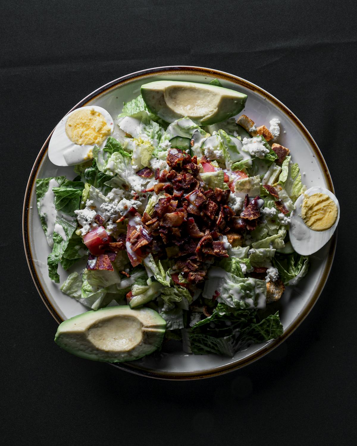 a bowl of salad on a plate