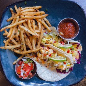 a plate of food that is on the side of fries