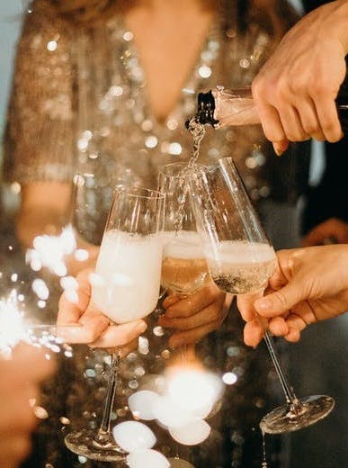 people raising a toast with champagne