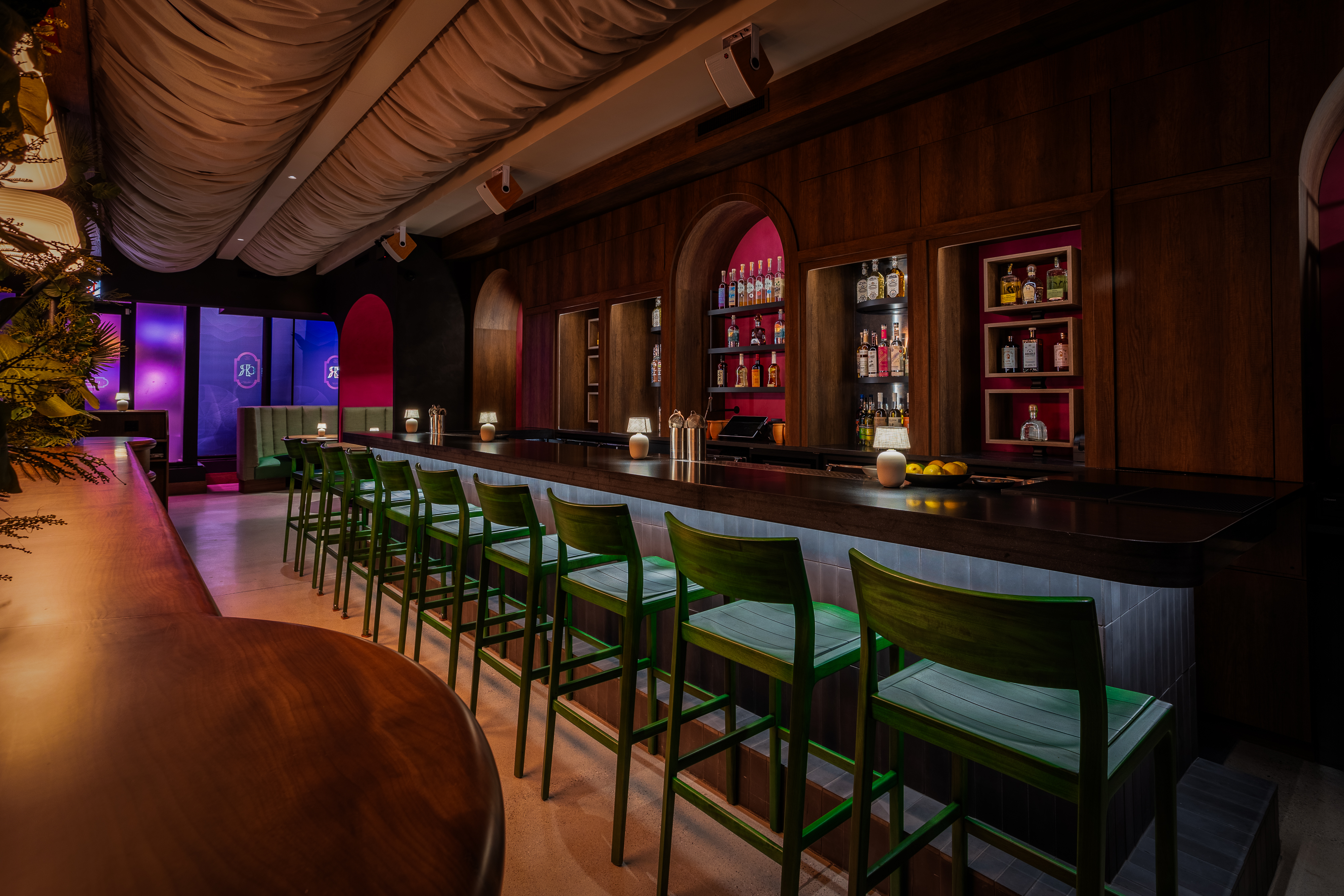 a group of people sitting at a table in a restaurant