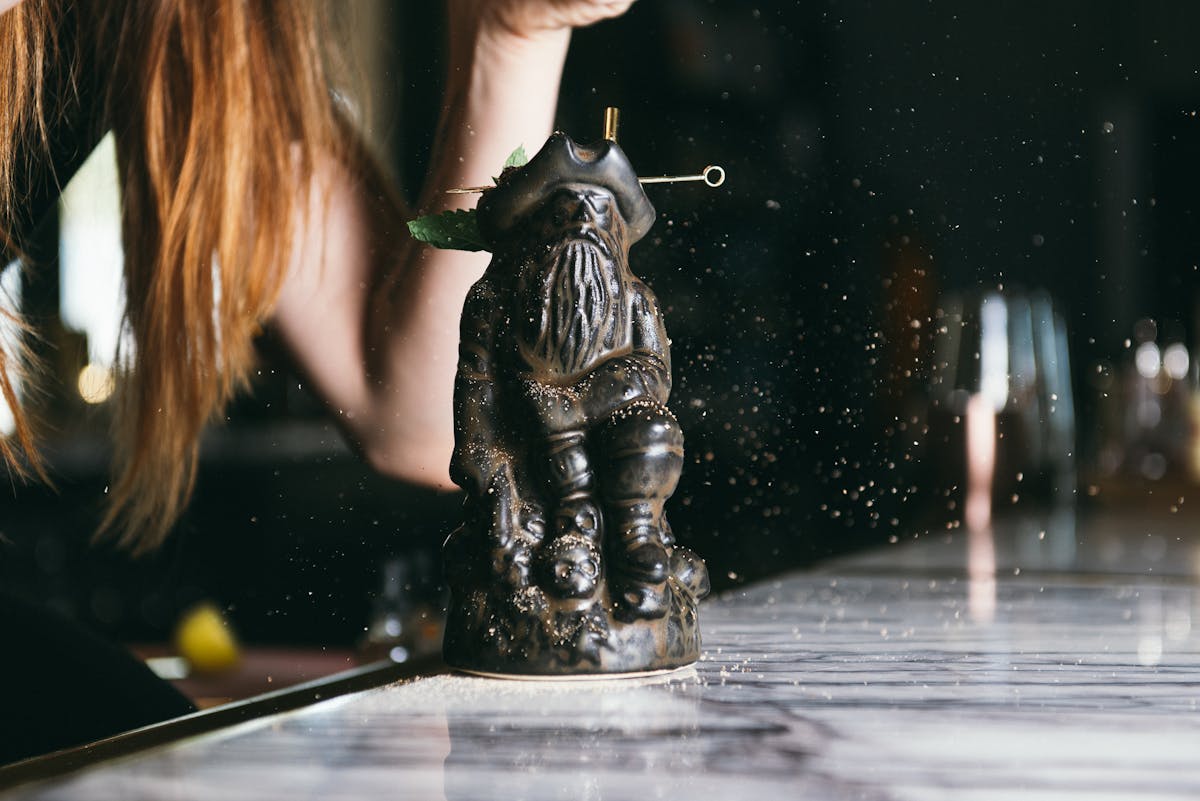 a small sculpture of a beareded man