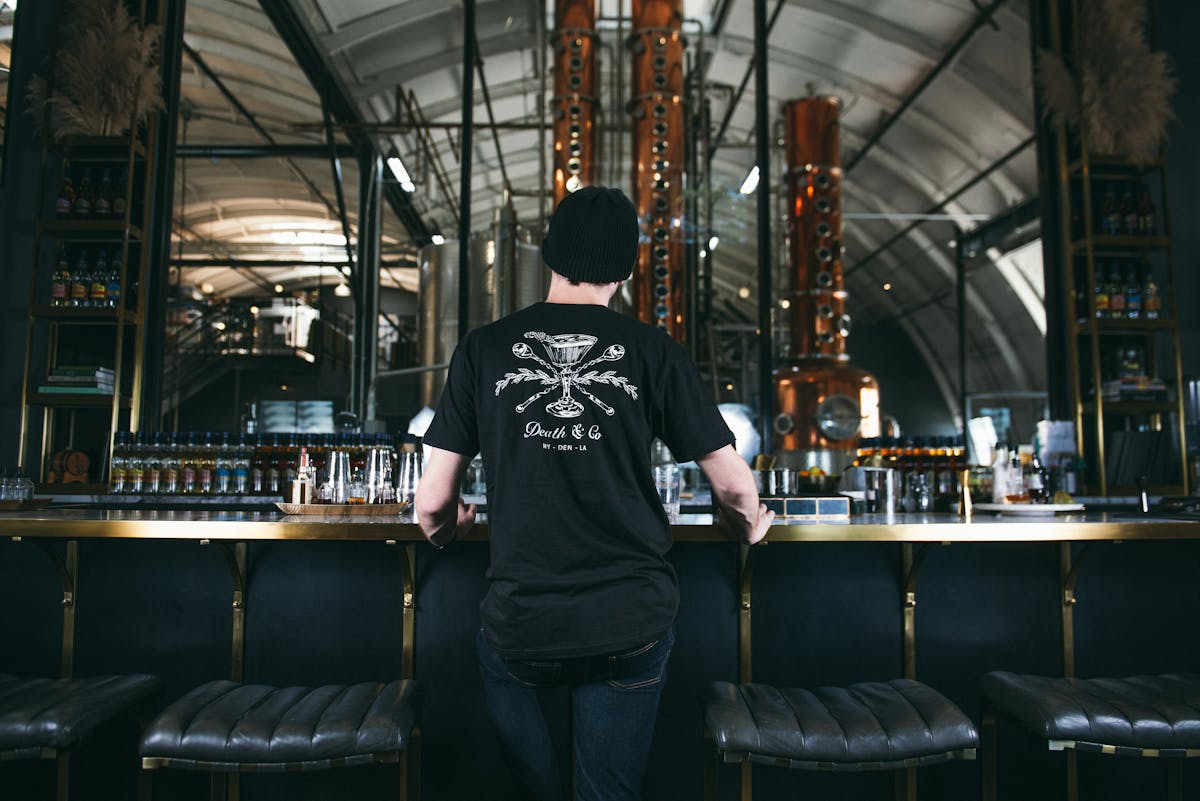 a man using the black shirt from death and co