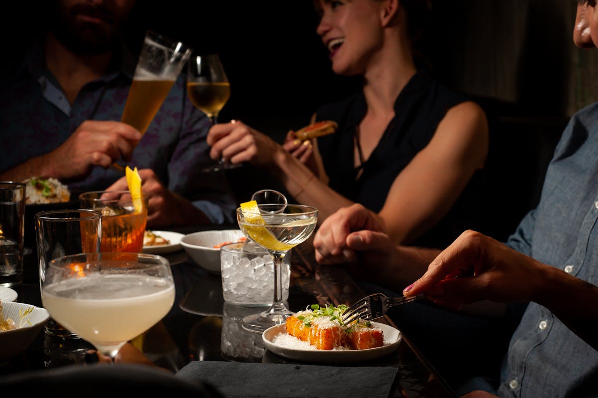 people having cocktails on a table