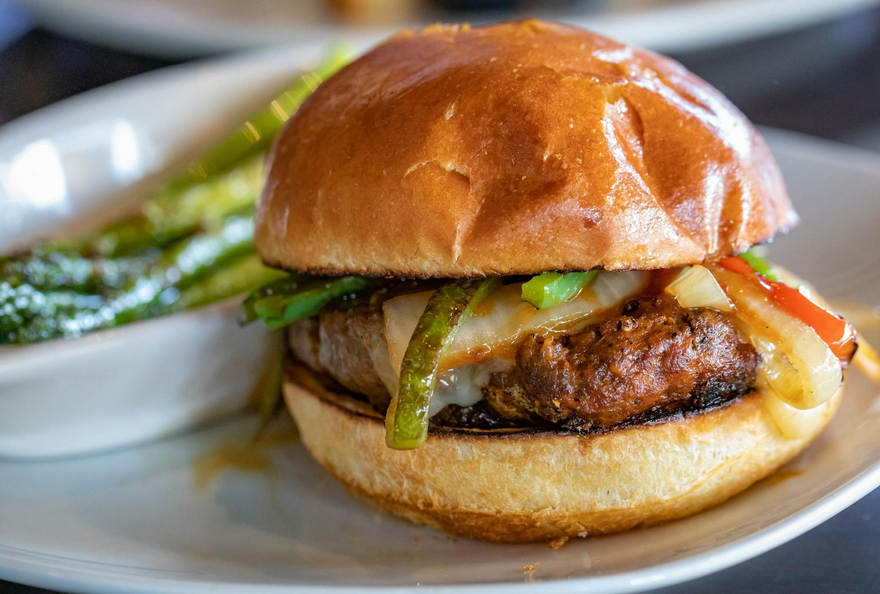 a close up of a hamburger on a plate