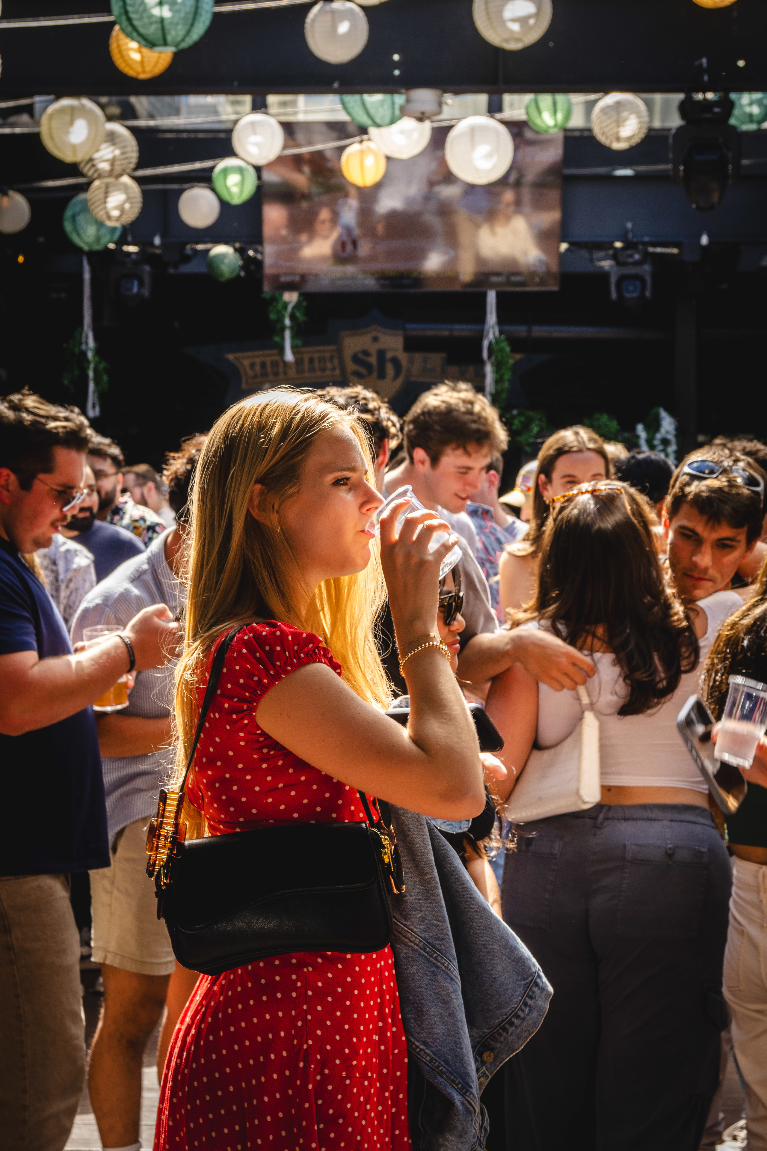 a group of people standing in front of a crowd
