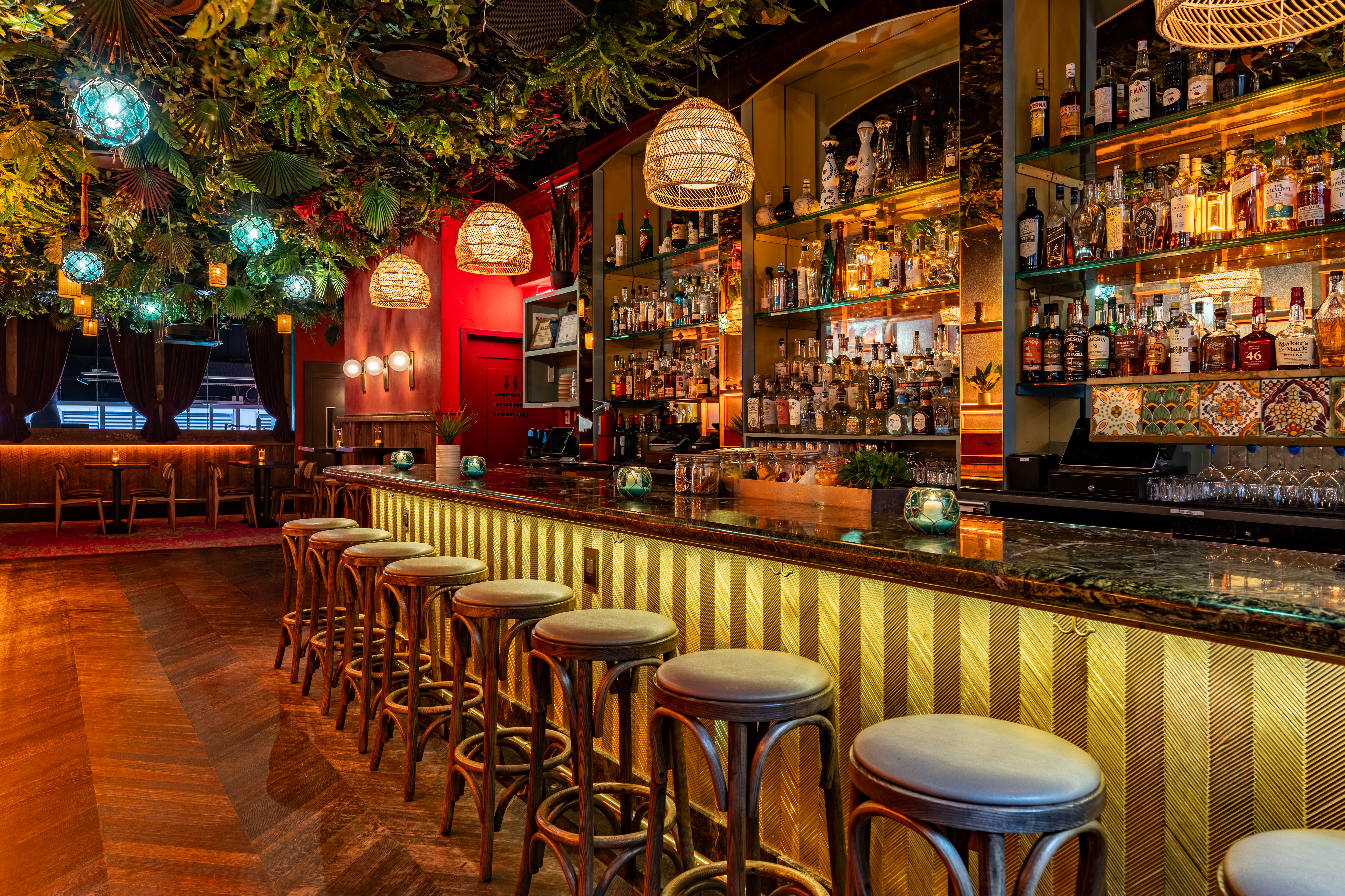 a group of people sitting at a table in front of a store