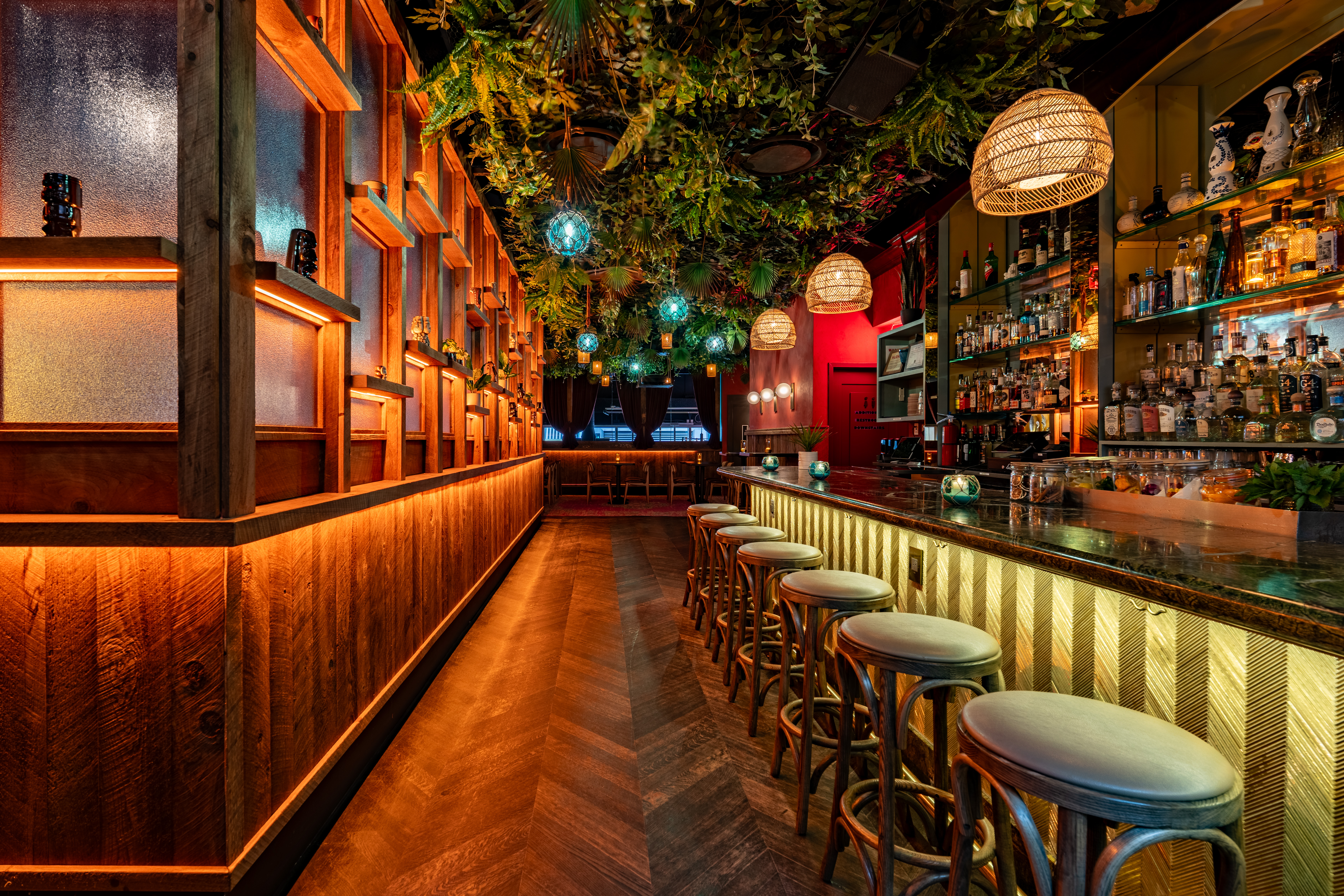 a group of people sitting at a table in front of a store