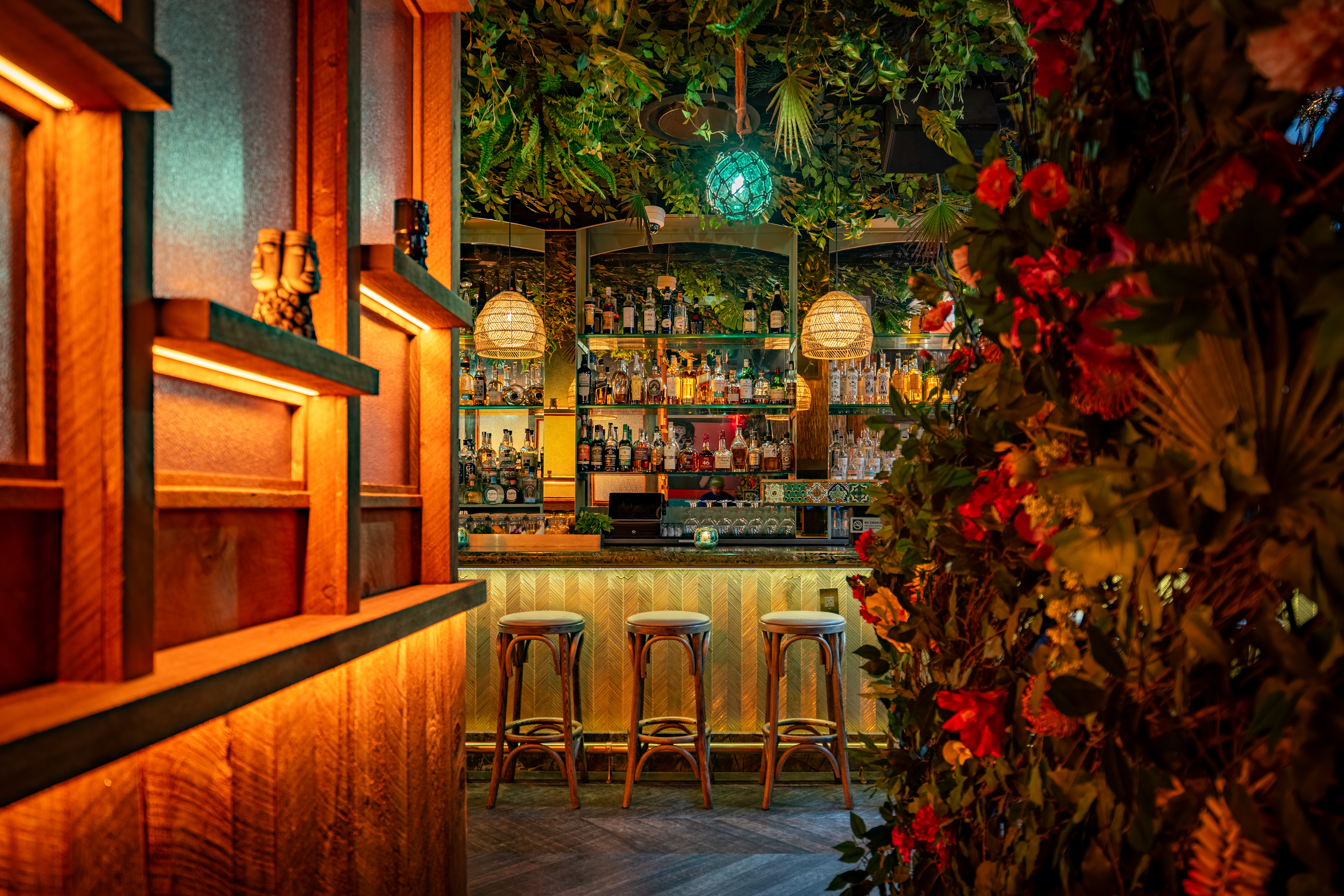 a vase of flowers sits in front of a window