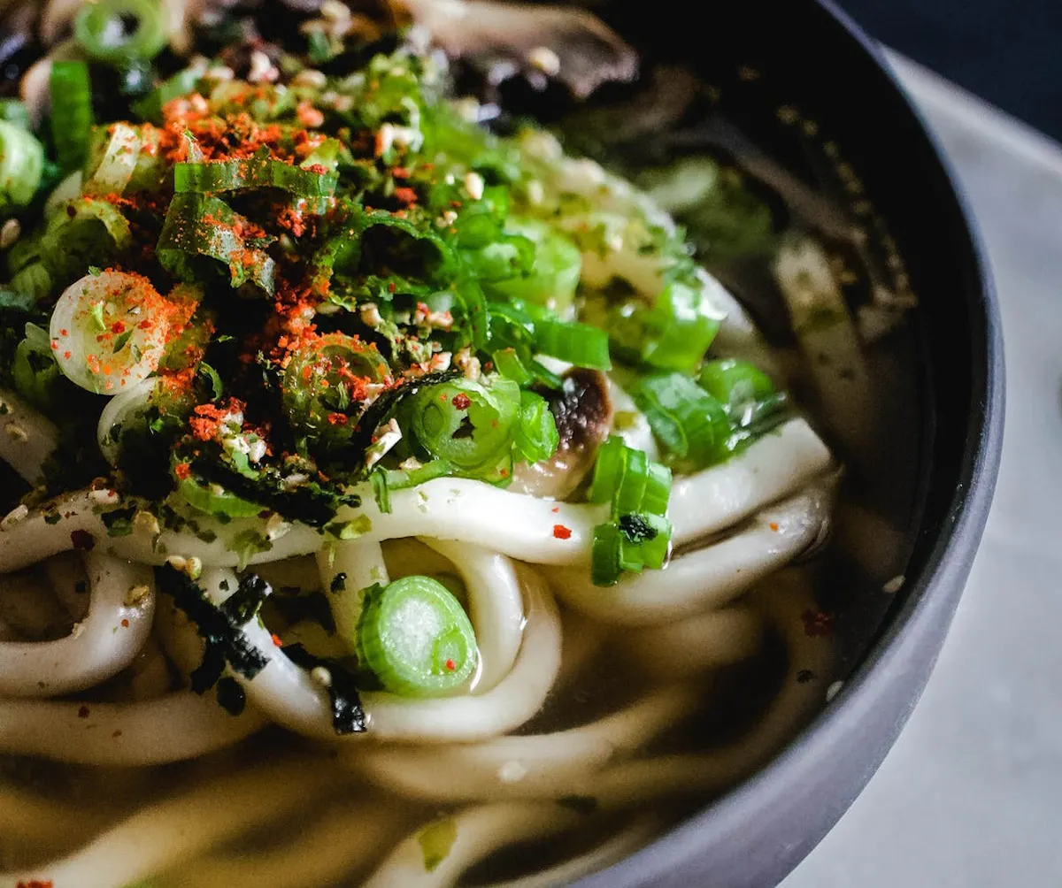 a bowl of food with broccoli