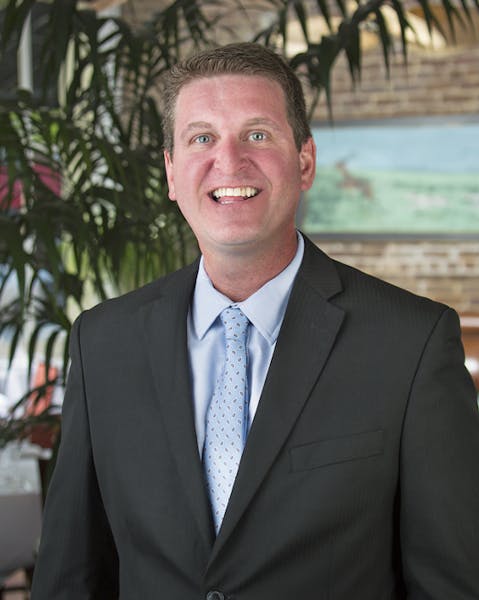 a man wearing a suit and tie