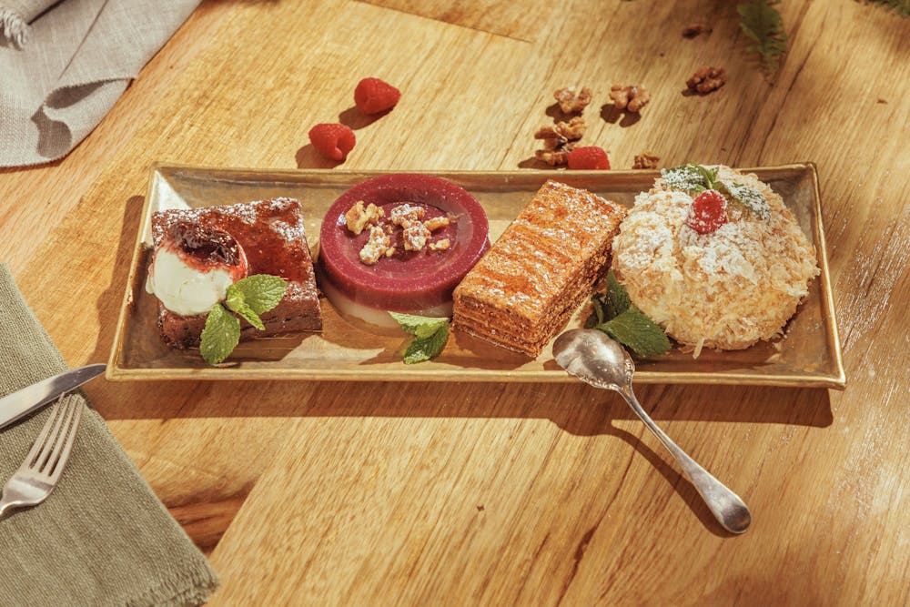 a room filled with furniture and vase of flowers on a table