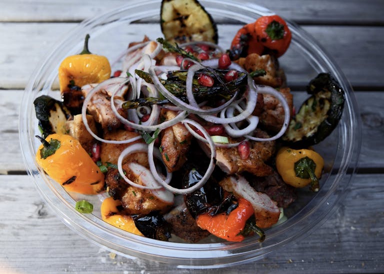 Chicken skewers, served with grilled vegetables