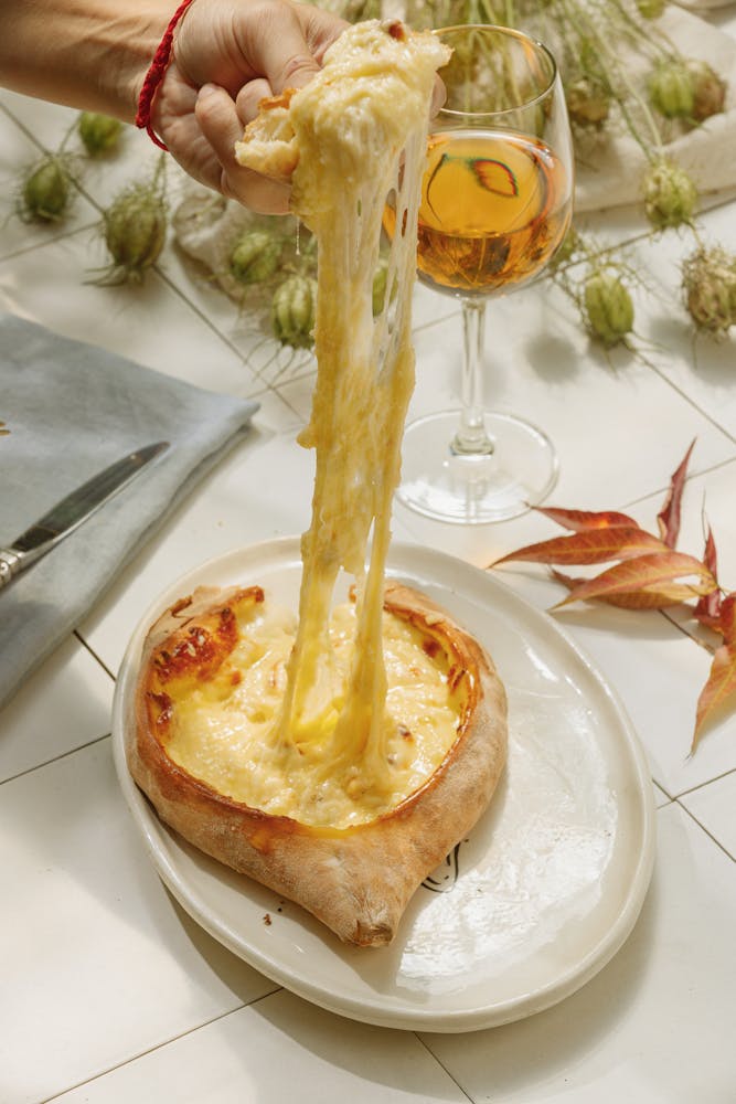 a pink flower is standing in front of a building