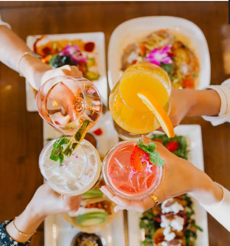 a person holding a tray of food