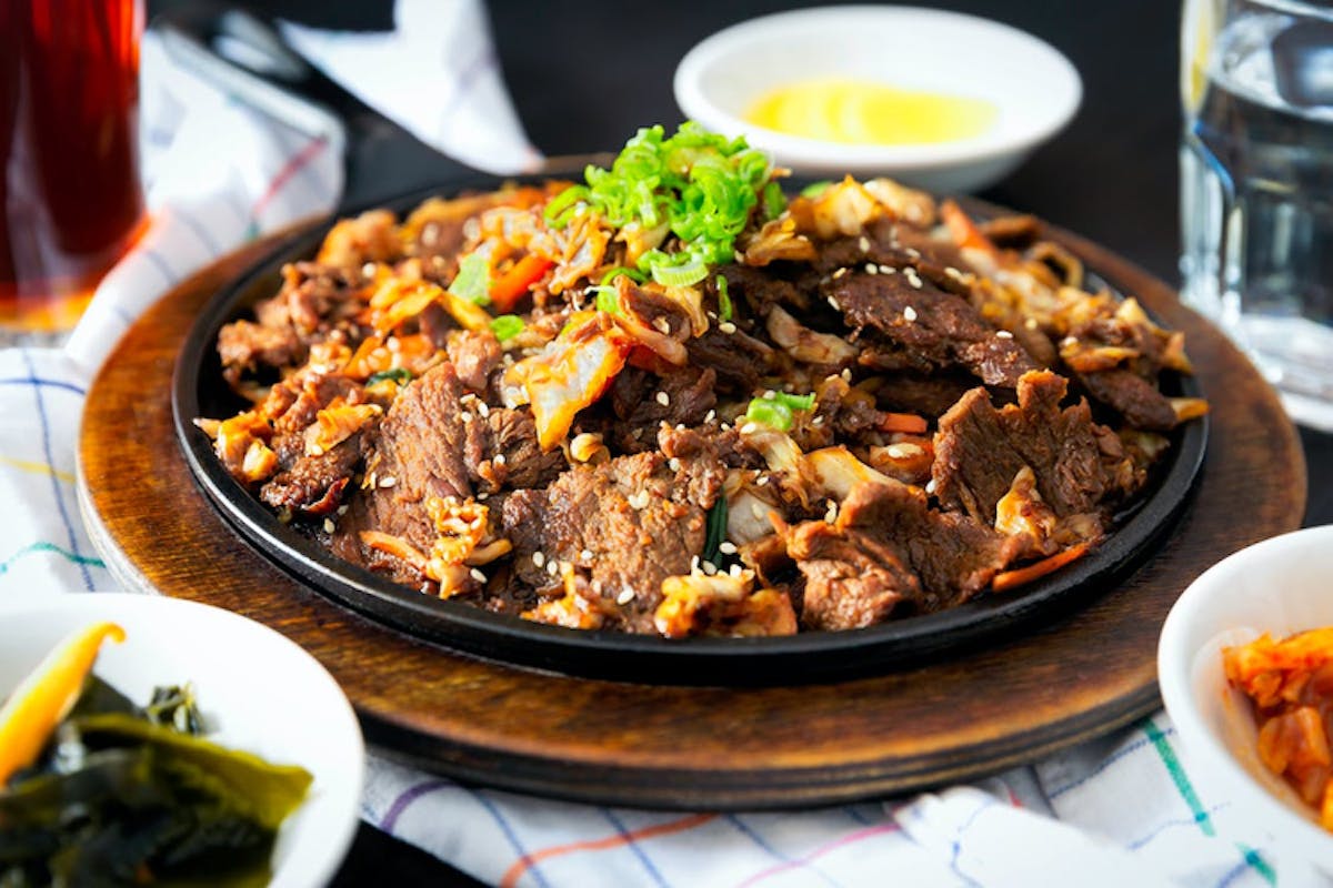 a plate full of food sitting on a table