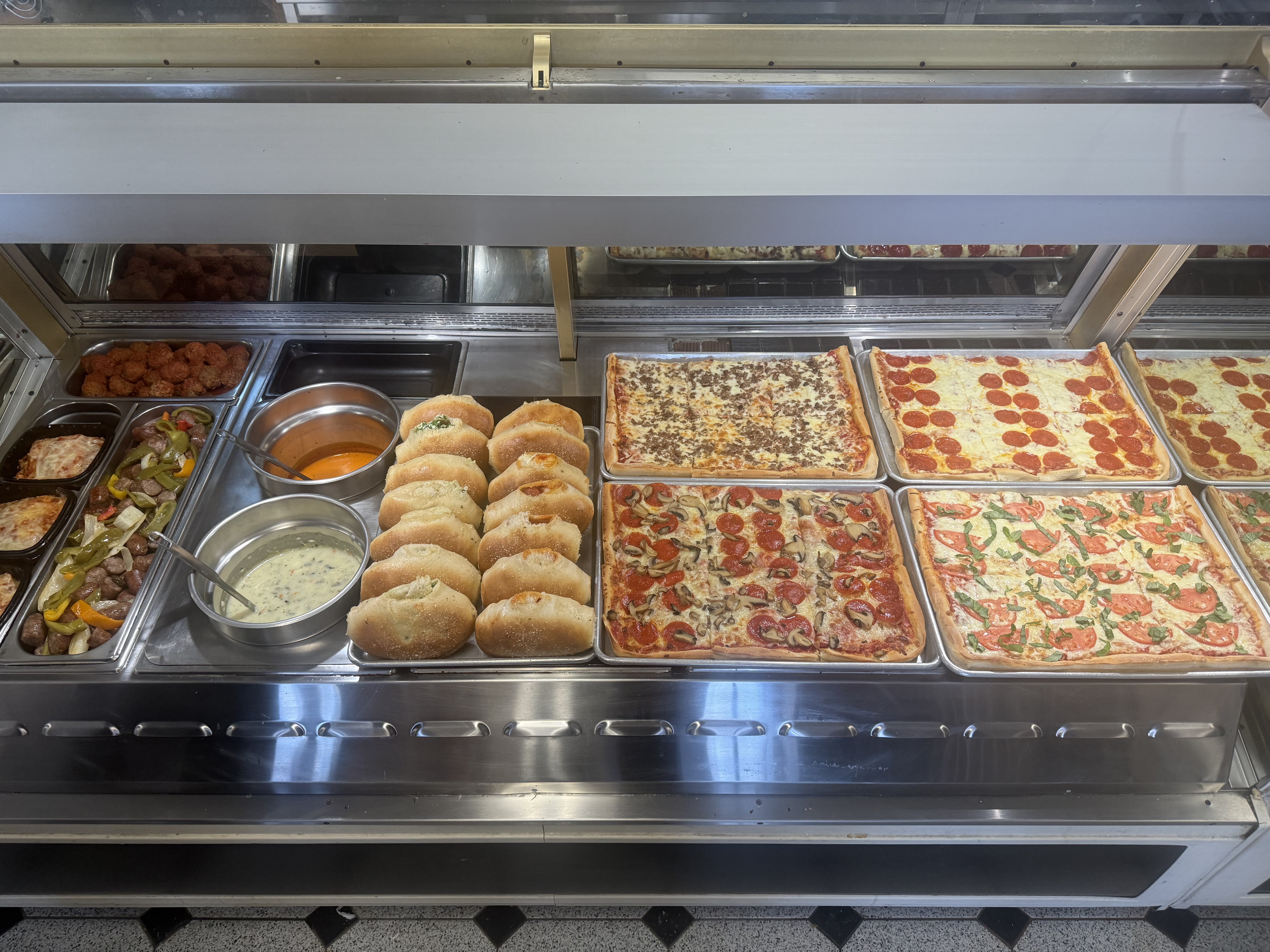 Pizza, calzones, soup, lasagna slices, Italian sausage and meatballs