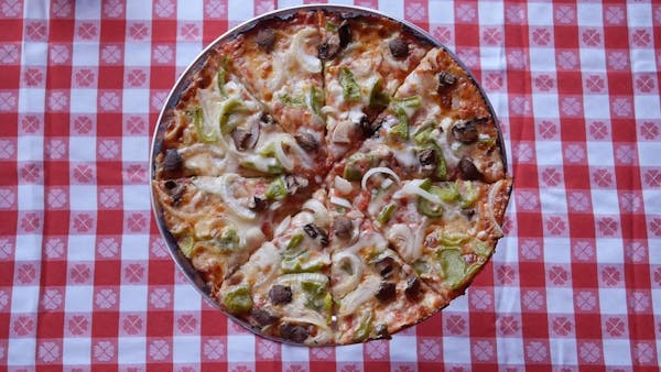 a pizza sitting on top of a table