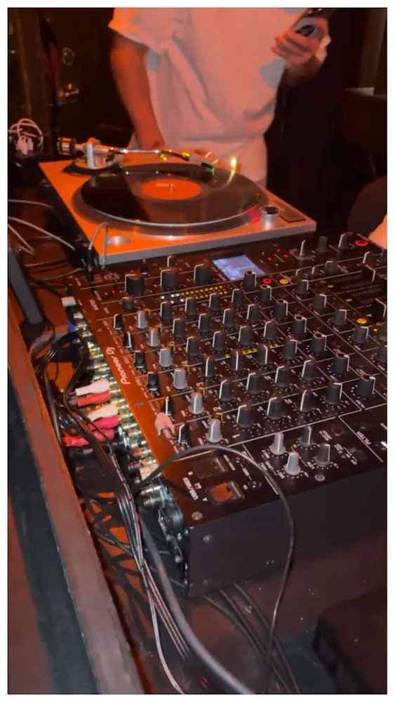 a dj mixer with a turntable and a record player