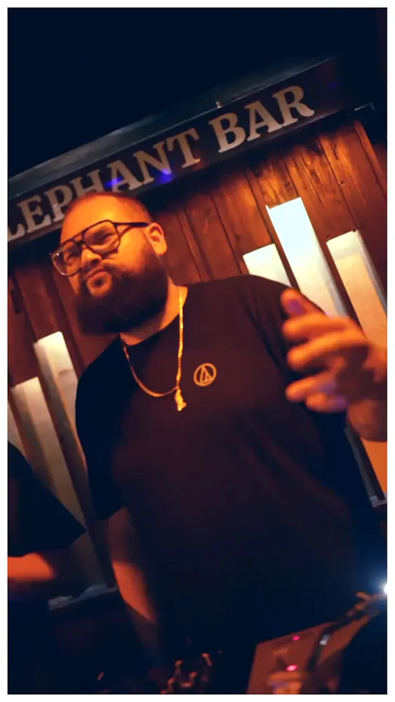a man with a beard and glasses