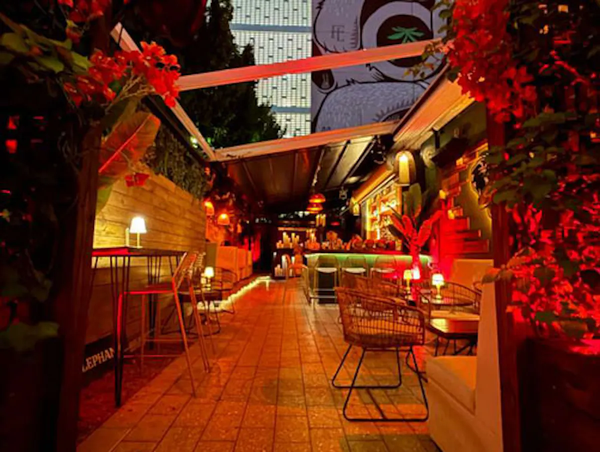 a long walkway with tables and chairs