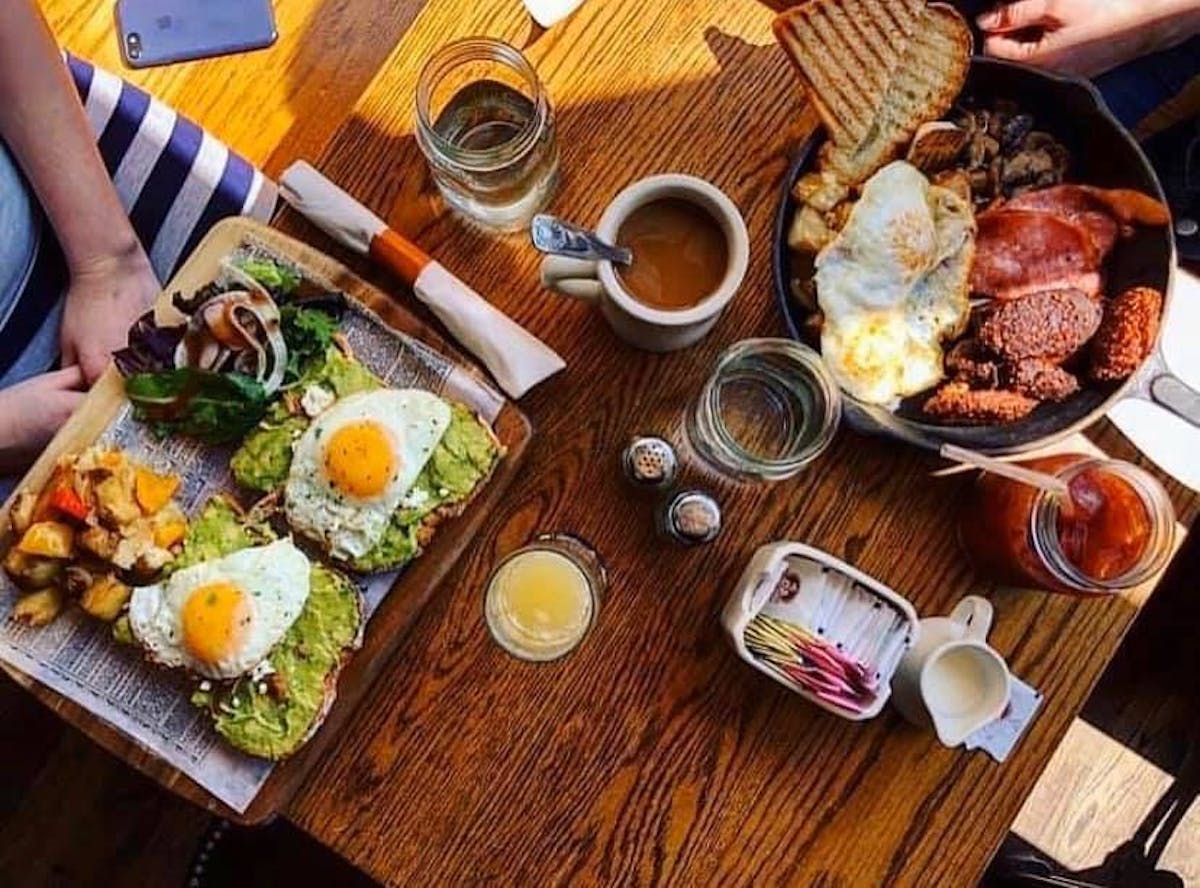 a plate of food on a wooden table