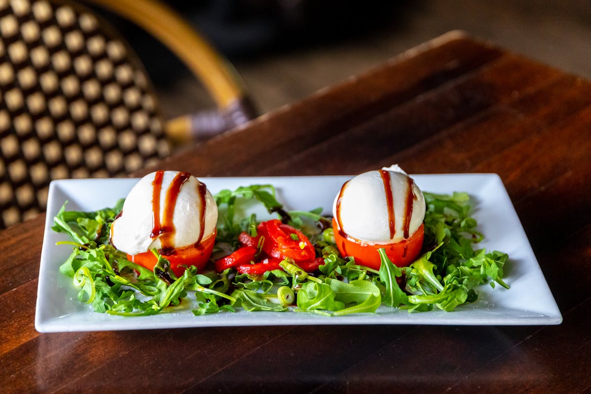 a salad sitting on top of a wooden table