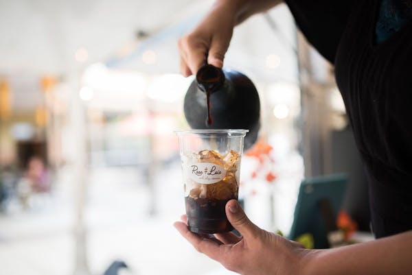 a person serving a coffee